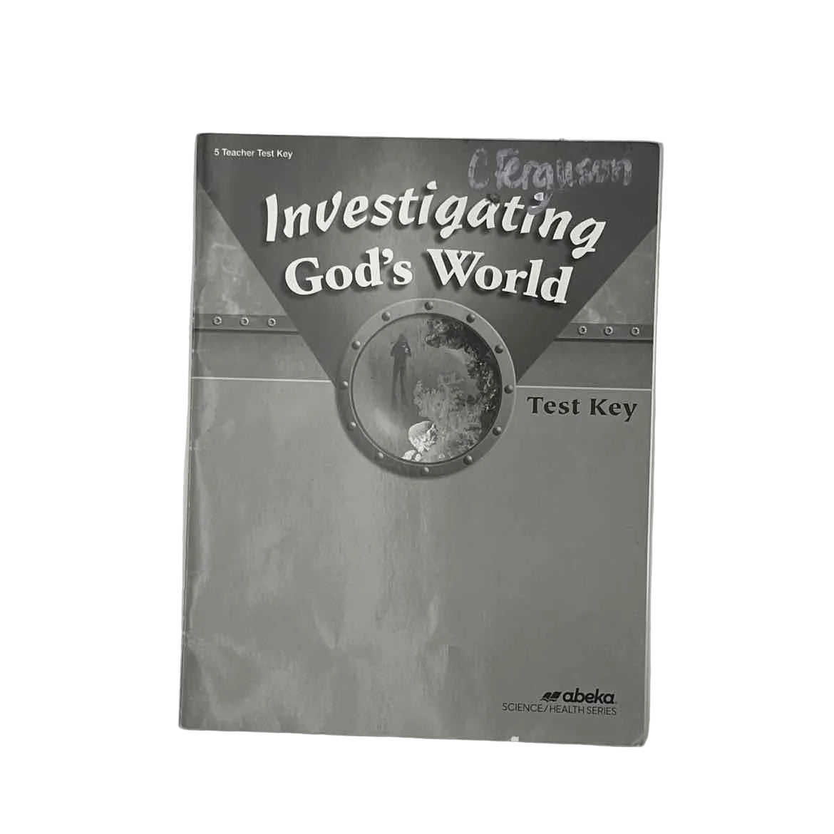 A Beka 5th Grade Investigating God's World Test Key (name on front) on a white background.